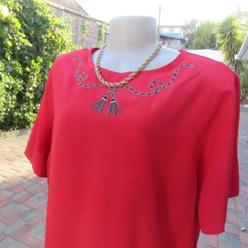 Cherry red slip over silky 100% polyester short sleeve top with stunning embroidery.Size 48.As new