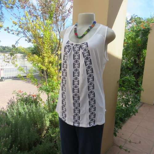 White sleeveless OLD KHAKI top with 3 front navy embroidered stripes. Size 38/14. Sheer yoke.