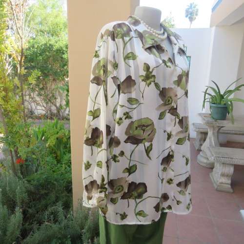 Smart white long sleeve top with green/brown flowers and sheer stripes.Size 50/26. By PENNY C.As new