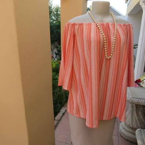 Naked shoulder vertical striped soft polycotton stretch top in shades of peach. Size 34 to 36.As new