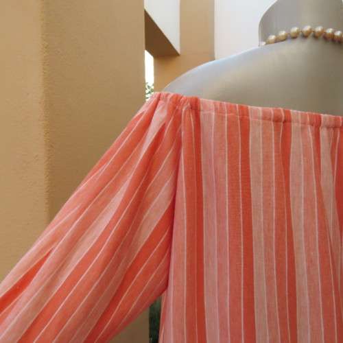 Naked shoulder vertical striped soft polycotton stretch top in shades of peach. Size 34 to 36.As new