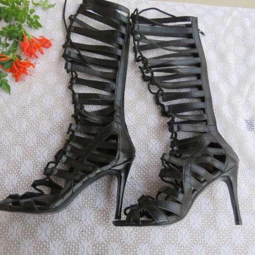 As new knee high lace up stilettos in black. Zip at back.By Boity x LEGIT size 7.
