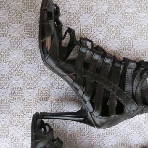 As new knee high lace up stilettos in black. Zip at back.By Boity x LEGIT size 7.