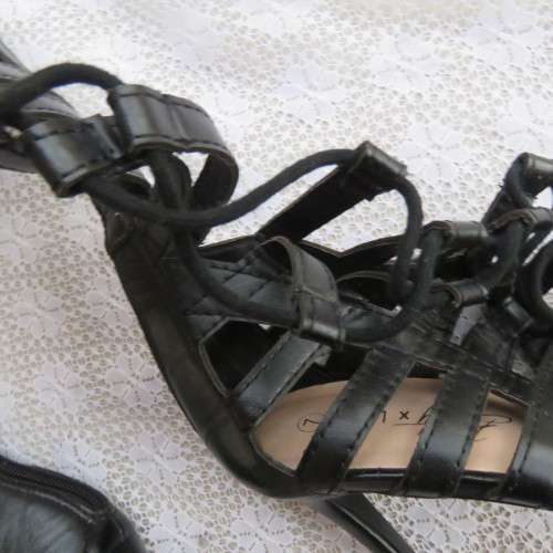 As new knee high lace up stilettos in black. Zip at back.By Boity x LEGIT size 7.