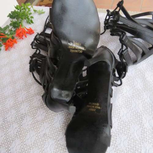 As new knee high lace up stilettos in black. Zip at back.By Boity x LEGIT size 7.