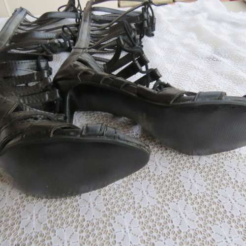 As new knee high lace up stilettos in black. Zip at back.By Boity x LEGIT size 7.