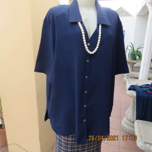 Silky navy 100% polyester short sleeve button down V neck top with Johnny collar.Size 50/26