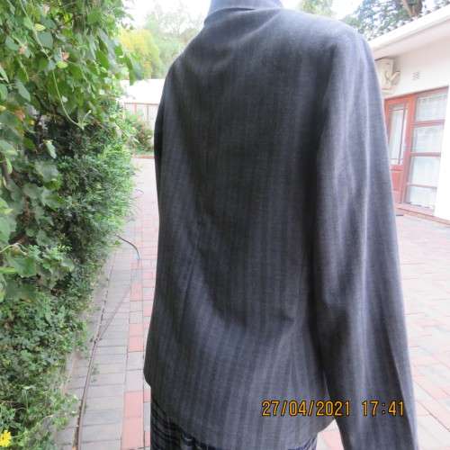Versatile blazer style grey jacket with thin black vertical stripes. Size 40/16 by EXACT. As new.
