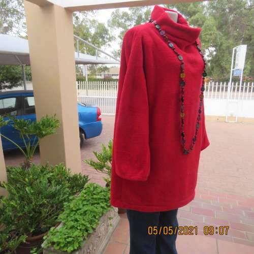 Warm red polyester fleeze long sleeve top with polo neck. Owner made size 44/20.As new