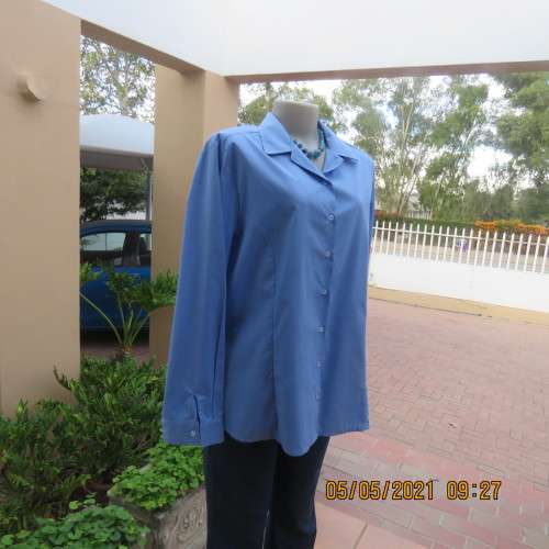 As new skyblue button down shirt with princess cut on front. Shirt collar. By ENVOY in size 42/18.