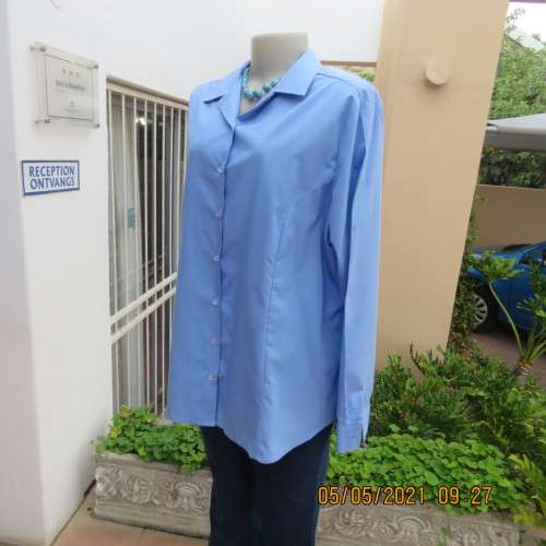 As new skyblue button down shirt with princess cut on front. Shirt collar. By ENVOY in size 42/18.