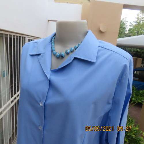 As new skyblue button down shirt with princess cut on front. Shirt collar. By ENVOY in size 42/18.