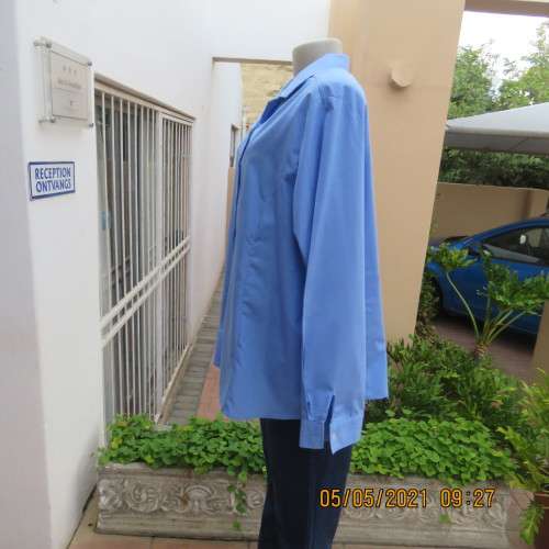 As new skyblue button down shirt with princess cut on front. Shirt collar. By ENVOY in size 42/18.