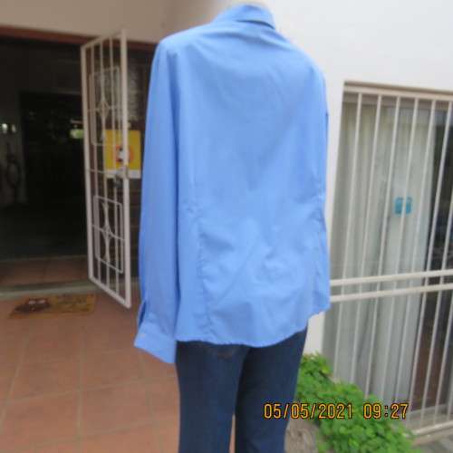 As new skyblue button down shirt with princess cut on front. Shirt collar. By ENVOY in size 42/18.
