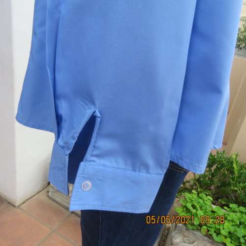 As new skyblue button down shirt with princess cut on front. Shirt collar. By ENVOY in size 42/18.
