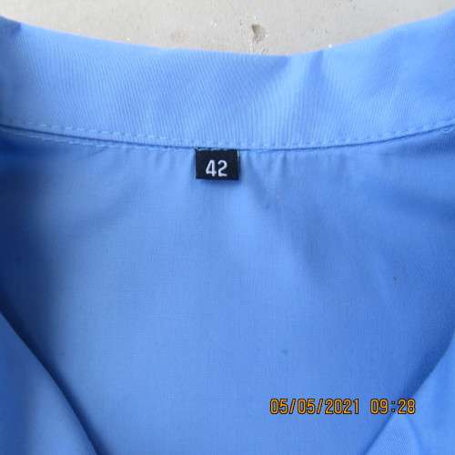 As new skyblue button down shirt with princess cut on front. Shirt collar. By ENVOY in size 42/18.