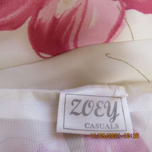 Timeless cream sheer polyester straight maxi skirt with bold pink flowers Size 48/24.As new