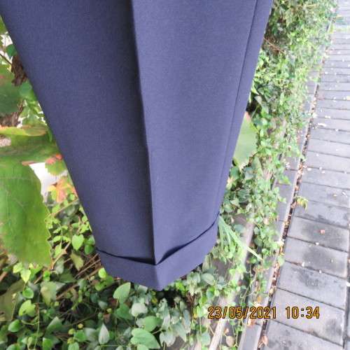 Smart navy Men`s pants by SIGNATURE in size 30. Pleats on front. Turnups on legs. New condition.