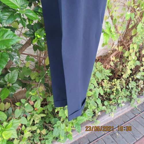 Smart navy Men`s pants by SIGNATURE in size 30. Pleats on front. Turnups on legs. New condition.
