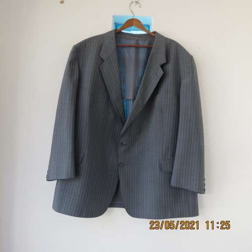 Handsome Men`s silvergrey pinstripe jacket in size 42.Used once. Washable.Pockets front and inside.