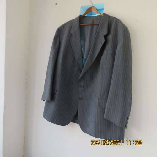 Handsome Men`s silvergrey pinstripe jacket in size 42.Used once. Washable.Pockets front and inside.