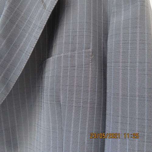 Handsome Men`s silvergrey pinstripe jacket in size 42.Used once. Washable.Pockets front and inside.