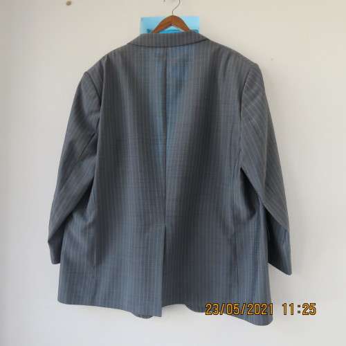 Handsome Men`s silvergrey pinstripe jacket in size 42.Used once. Washable.Pockets front and inside.