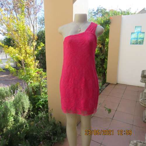 Seriously sexy pink one shoulder acrylic lace dress with stretch polyester inner. Size 34 to 36.