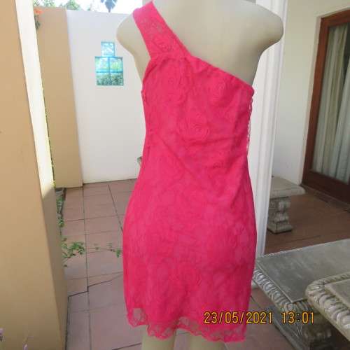 Seriously sexy pink one shoulder acrylic lace dress with stretch polyester inner. Size 34 to 36.