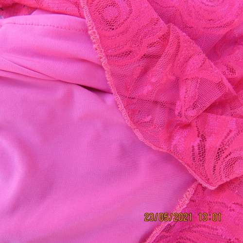 Seriously sexy pink one shoulder acrylic lace dress with stretch polyester inner. Size 34 to 36.