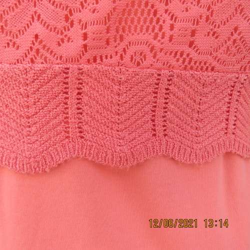 Lovely coral colour capped sleeve bolero in stretch acrylic lace. Size 34/10 by FASHION EXPRESS.