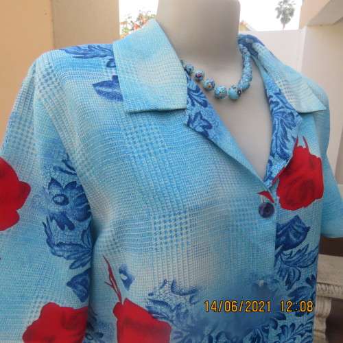 As new cheerful short sleeve top in blue floral pattern and red roses. Button down.Size 40/16.