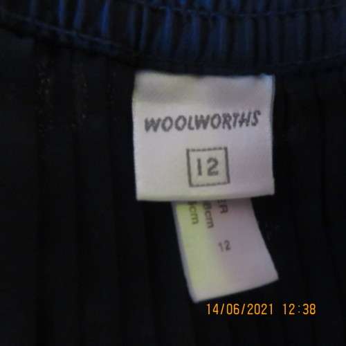 Smart permanent pleated navy 100% polyester calf length skirt with elasticated waist.Size 36/12.