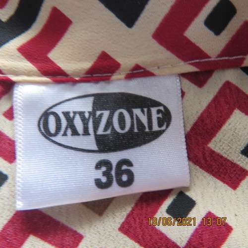 Classic geometric print cream short sleeve top with maroon/black print. Size 36/12.By OXYZONE.