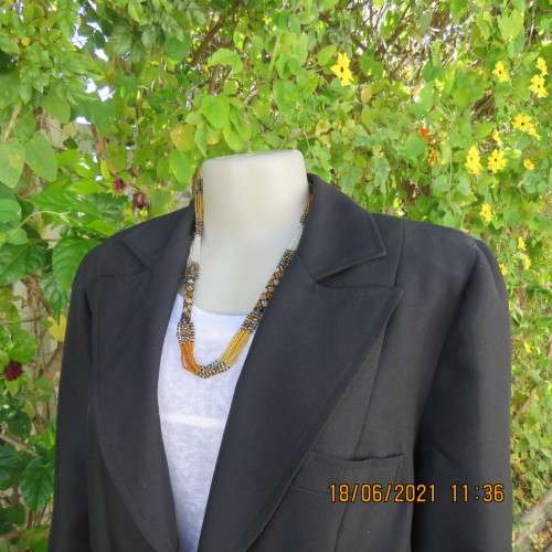 Blazer style black fully lined long sleeve jacket.With 3 front pockets. Size 36 to 38. Heavy poly.