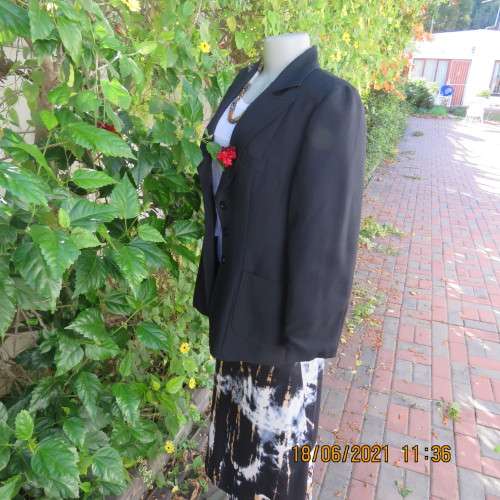 Blazer style black fully lined long sleeve jacket.With 3 front pockets. Size 36 to 38. Heavy poly.