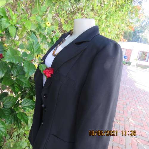 Blazer style black fully lined long sleeve jacket.With 3 front pockets. Size 36 to 38. Heavy poly.