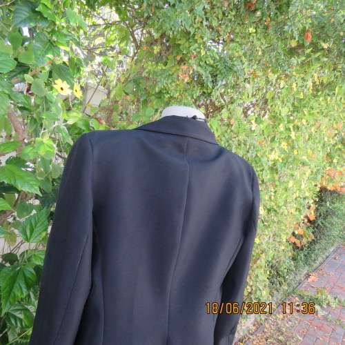 Blazer style black fully lined long sleeve jacket.With 3 front pockets. Size 36 to 38. Heavy poly.