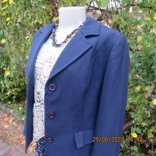 Best quality virgin wool and trevira navy jacket by NINO FLAIR from West Germany. Size 36/12.As new