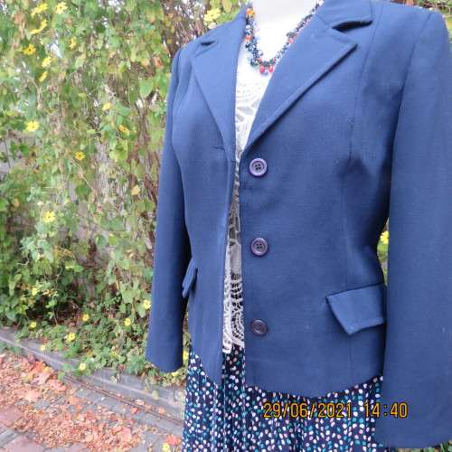 Best quality virgin wool and trevira navy jacket by NINO FLAIR from West Germany. Size 36/12.As new