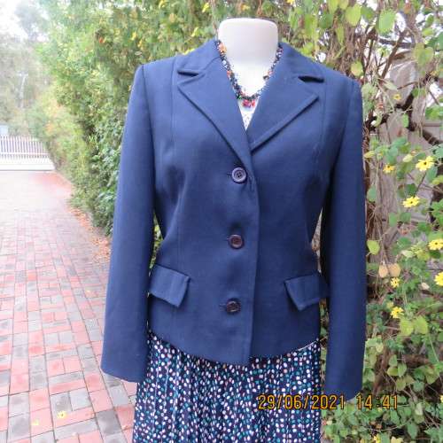 Best quality virgin wool and trevira navy jacket by NINO FLAIR from West Germany. Size 36/12.As new