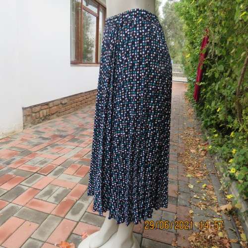 As new half flare permanent pleated navy ankle length skirt with jade/white/cream dots..Size 42/18.