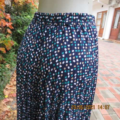 As new half flare permanent pleated navy ankle length skirt with jade/white/cream dots..Size 42/18.