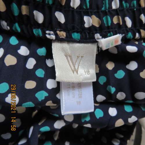As new half flare permanent pleated navy ankle length skirt with jade/white/cream dots..Size 42/18.