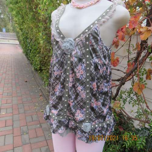 Summer olive green-cream check with blue-peach flowers.Adjustable straps.Size 34.As new