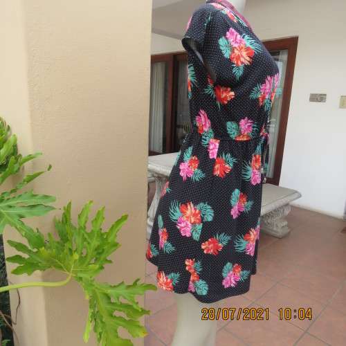 Sweet size 36/12 slip over mini dress with black/white polkadot background and floral design.