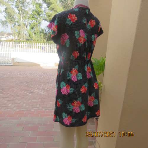 Sweet size 36/12 slip over mini dress with black/white polkadot background and floral design.