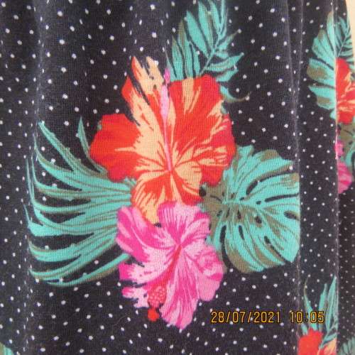 Sweet size 36/12 slip over mini dress with black/white polkadot background and floral design.