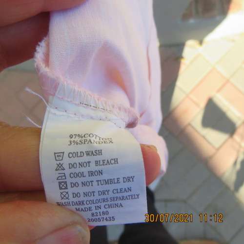 Sassy button down tailored top in pale peach and white vertical stripes. Size 34/10, Open collar.