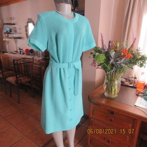 High quality vintage dress by MARCHESA from DELSWA size 42/18 in aquamarine crimplene.As new